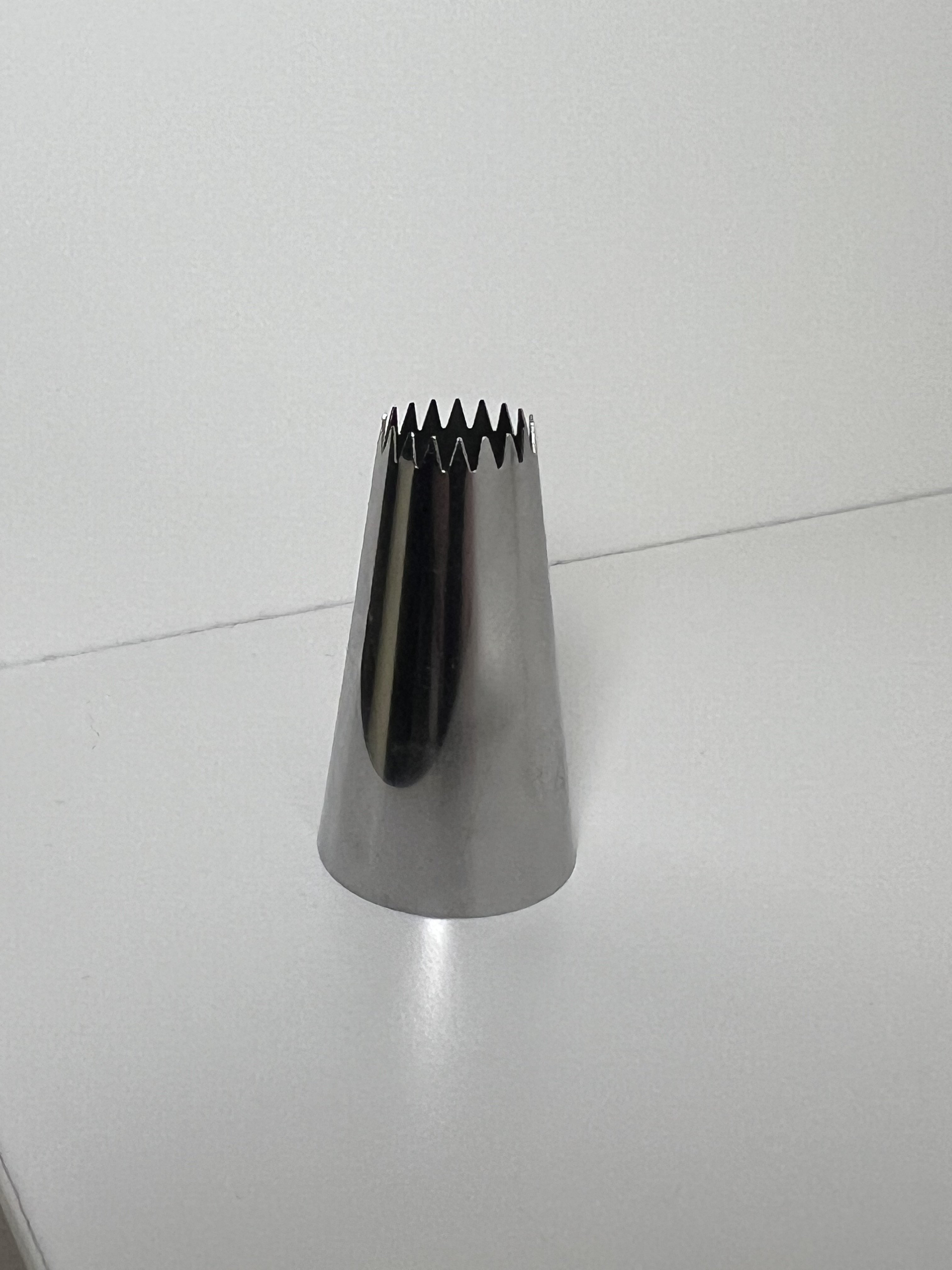 piping tip standing upright