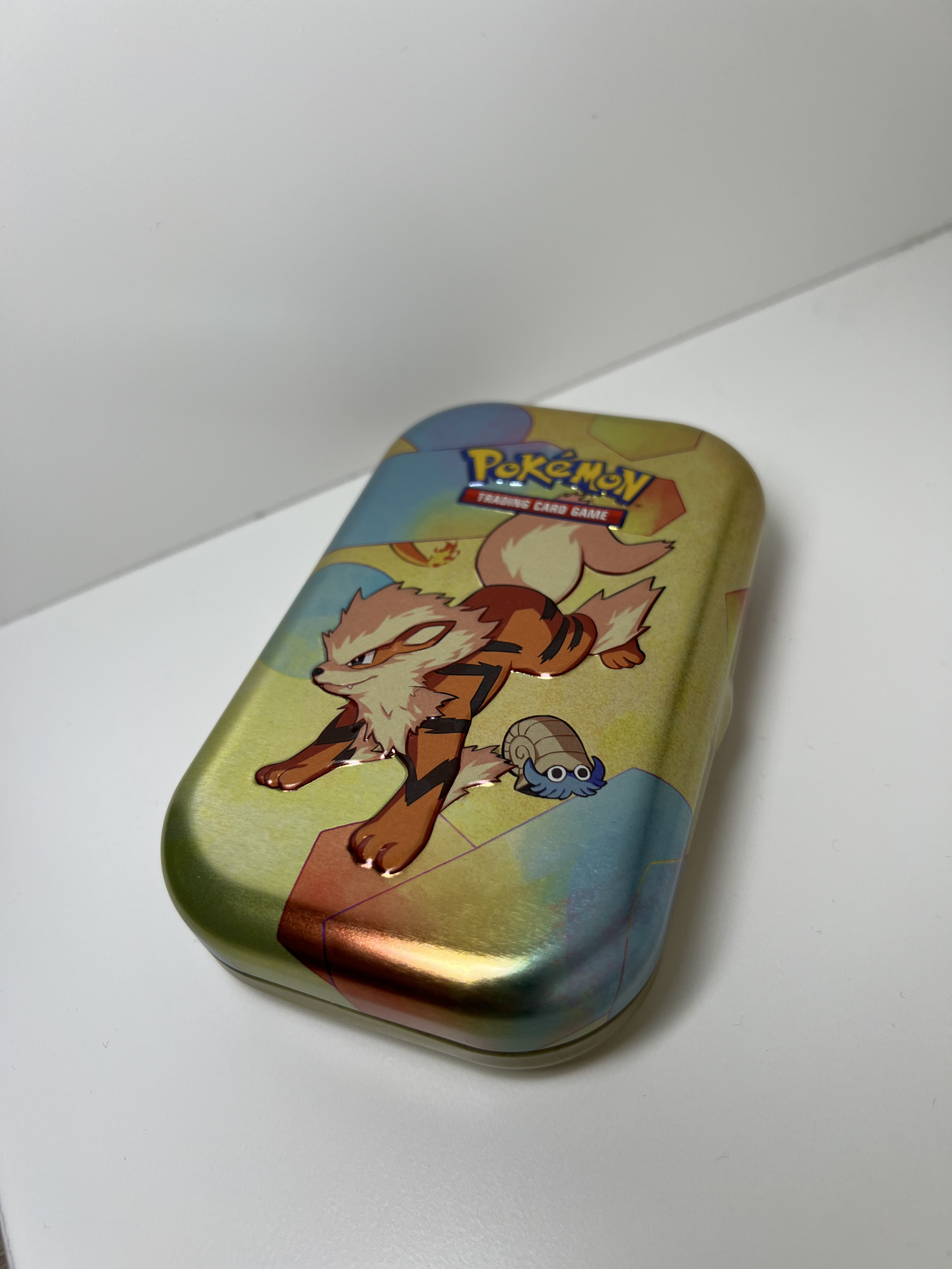 pokemon tin on its side top view
