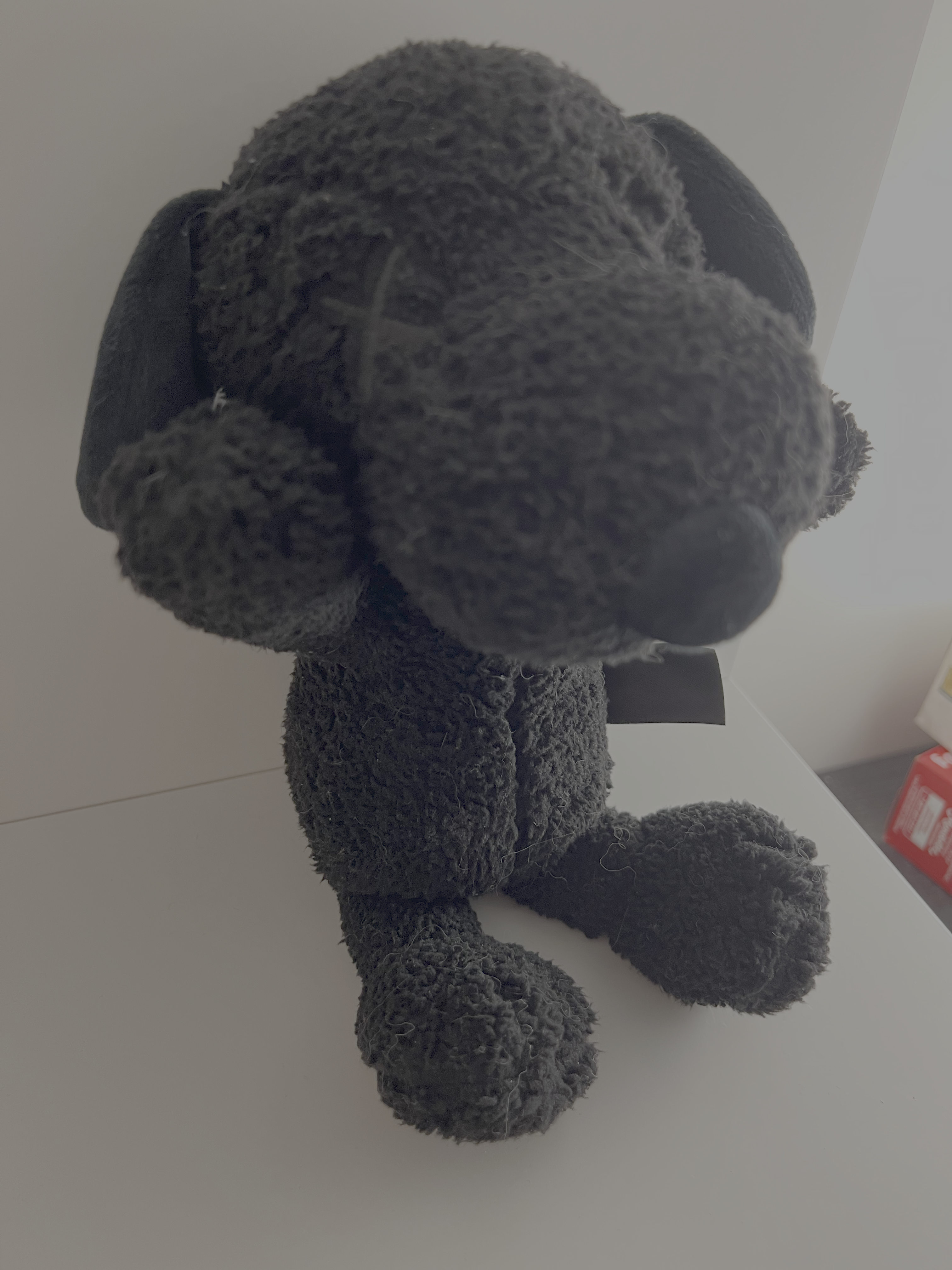 Chosen to show the proportions of the head versus the body from an overhead angle. This view emphasizes the taper of the ears and how the head shape dominates the figure’s silhouette.